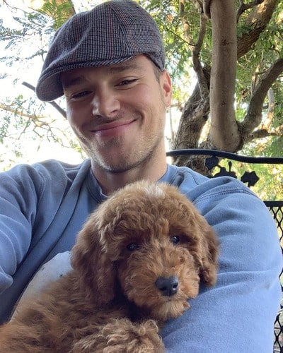 Matthew Noszkaa carrying his lovely pet